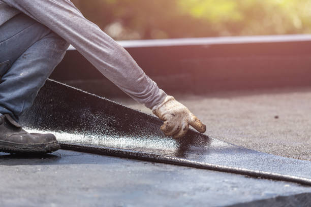 Professional Basement Waterproofing technician working in Richardsville, VA